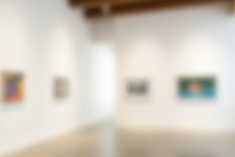 Interior view of Gekkou Gallery showcasing exhibited artworks